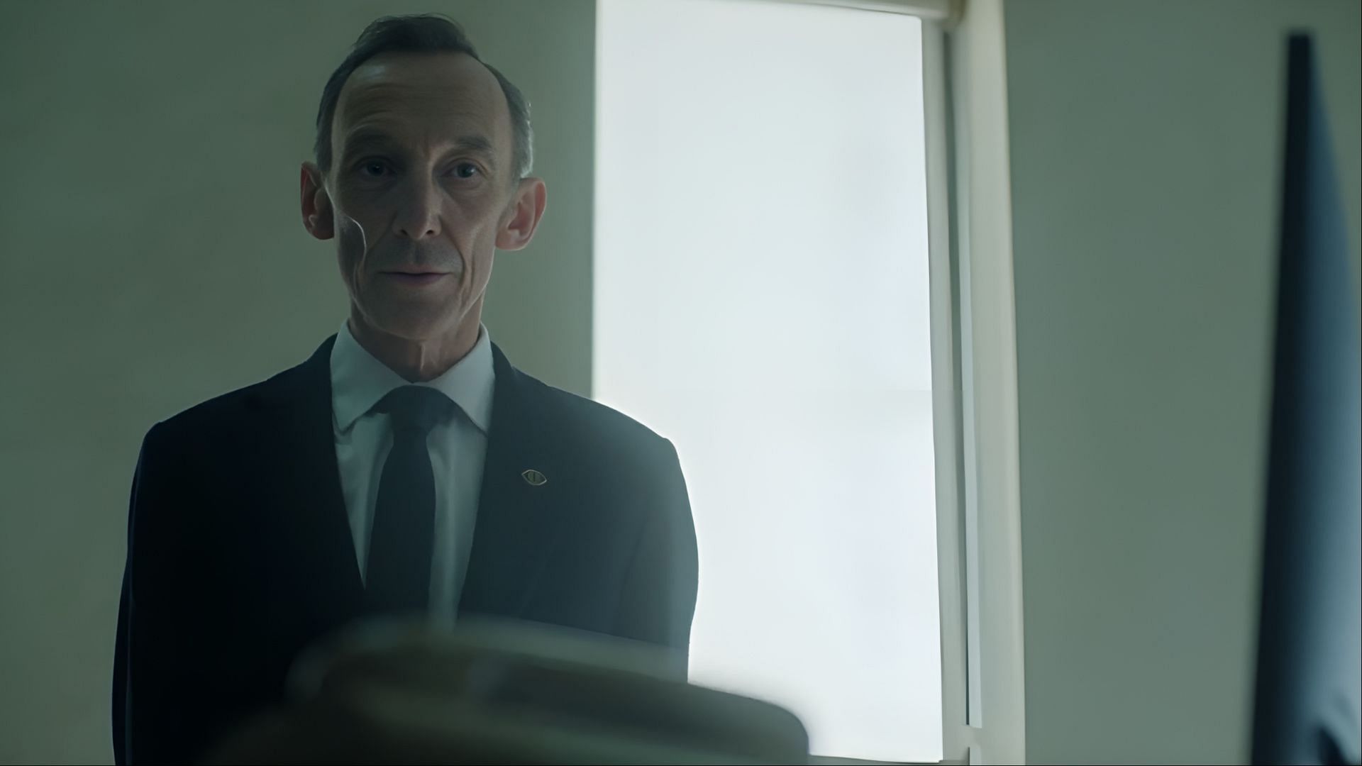 Stackhouse’s calm demeanor conceals his growing ambitions and secret betrayals in The Institute season 1. (Image via MGM)